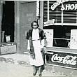 Mrs. Katie Groce in Front of the Barber Shop