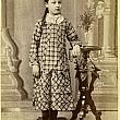 Young girl in plaid dress