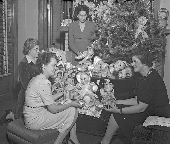 Dolls and Toys Under a Christmas Tree