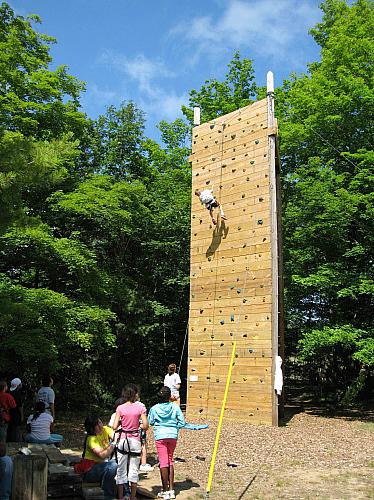 Climbing the Rock Wall at Camp Blodgett